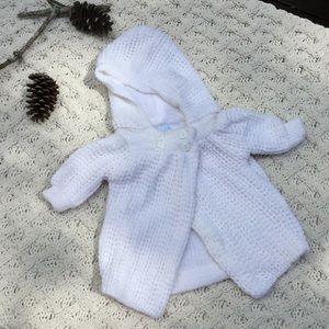 White knit baby girls cape with hood